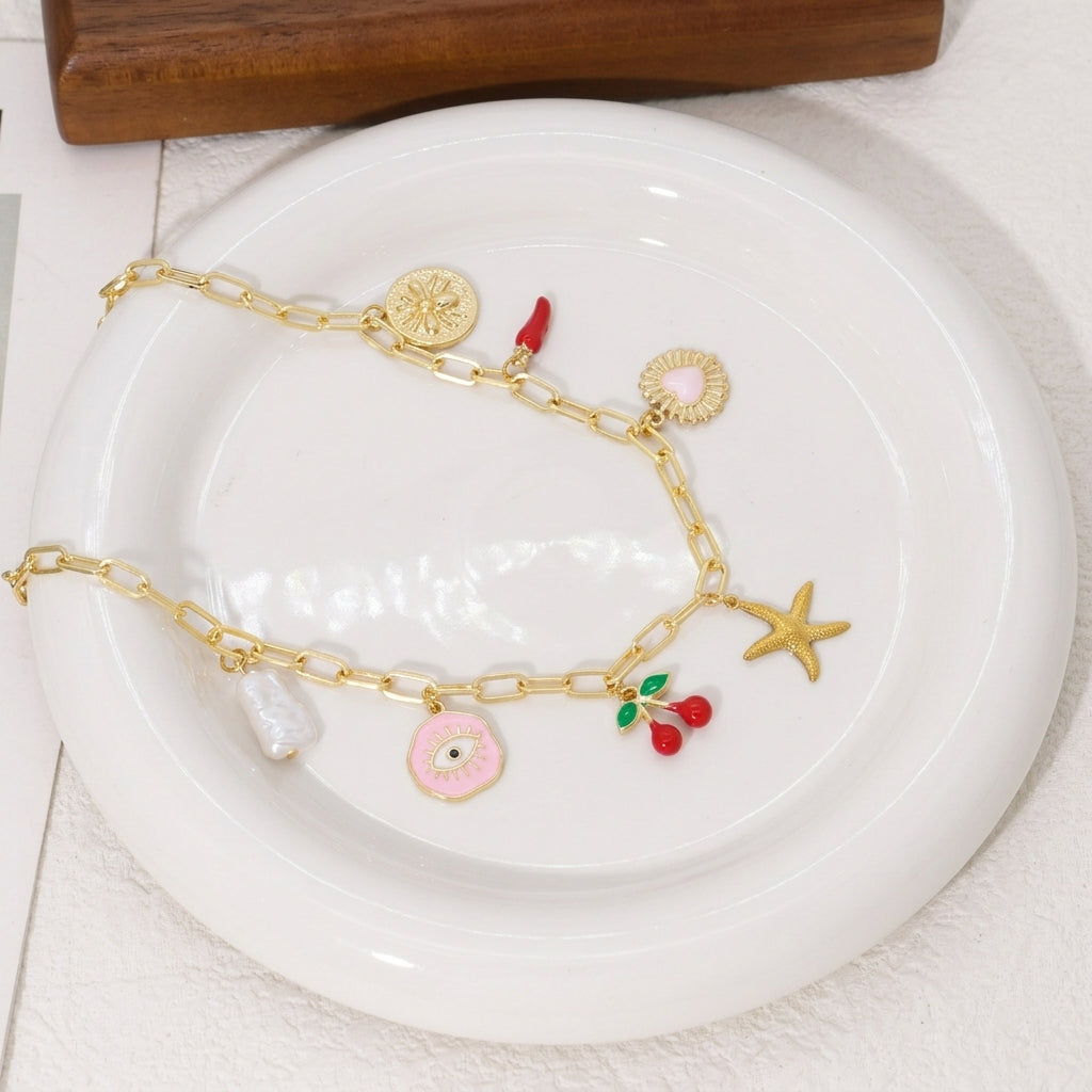 Collier chaîne trombone ludique avec 7 breloques