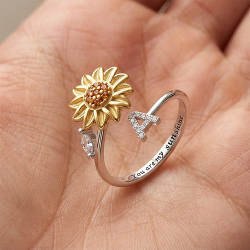 Anillo giratorio de girasol con inicial y la frase "Eres mi sol"