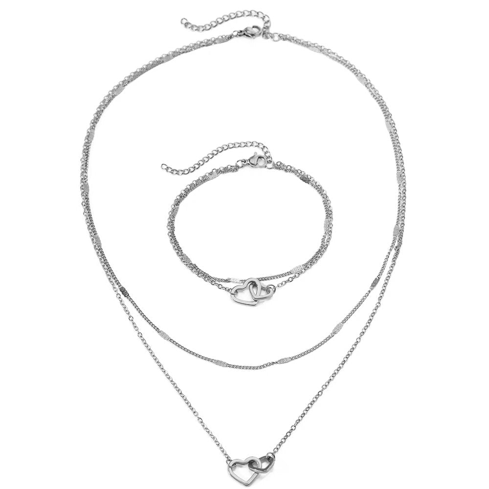Juego de collar y pulsera con corazones dobles, eslabones curb y de cadena delicados