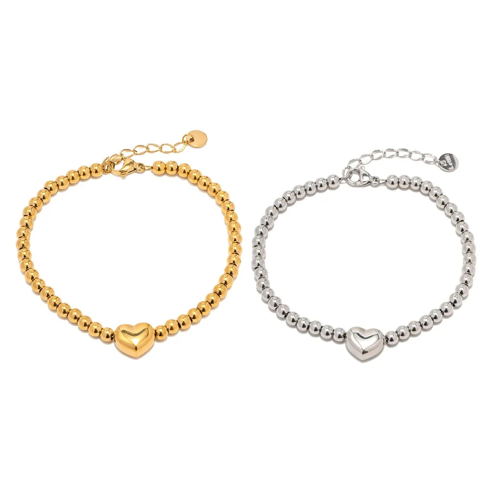 Elegancka bransoletka z koralikami i sercem, 18k