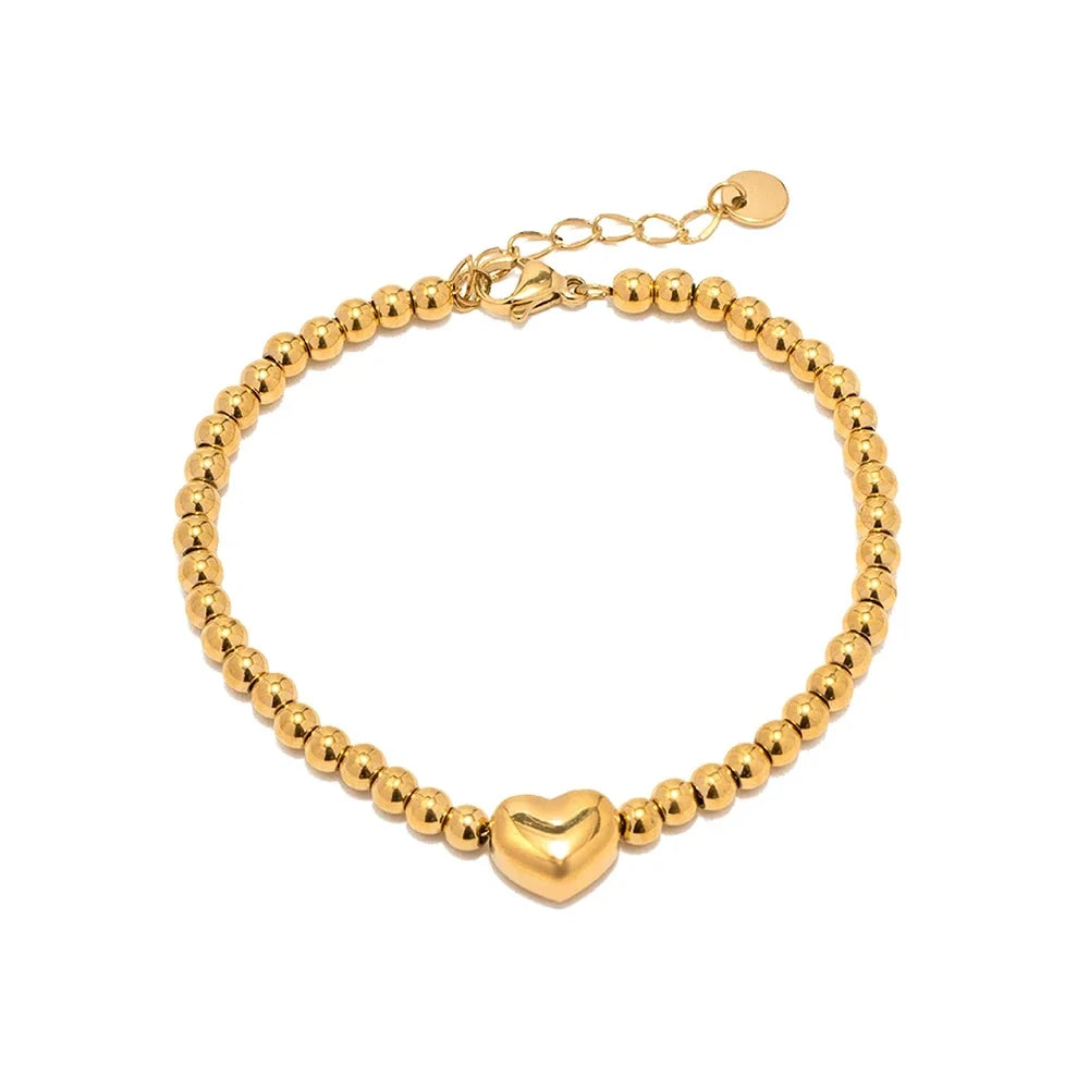 Elegancka bransoletka z koralikami i sercem, 18k