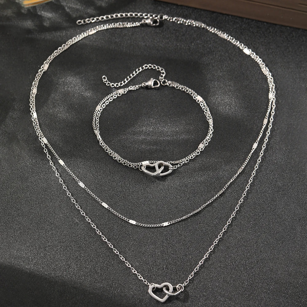 Juego de collar y pulsera con corazones dobles, eslabones curb y de cadena delicados
