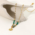 Collana delicata con pendente a sole di ispirazione boho