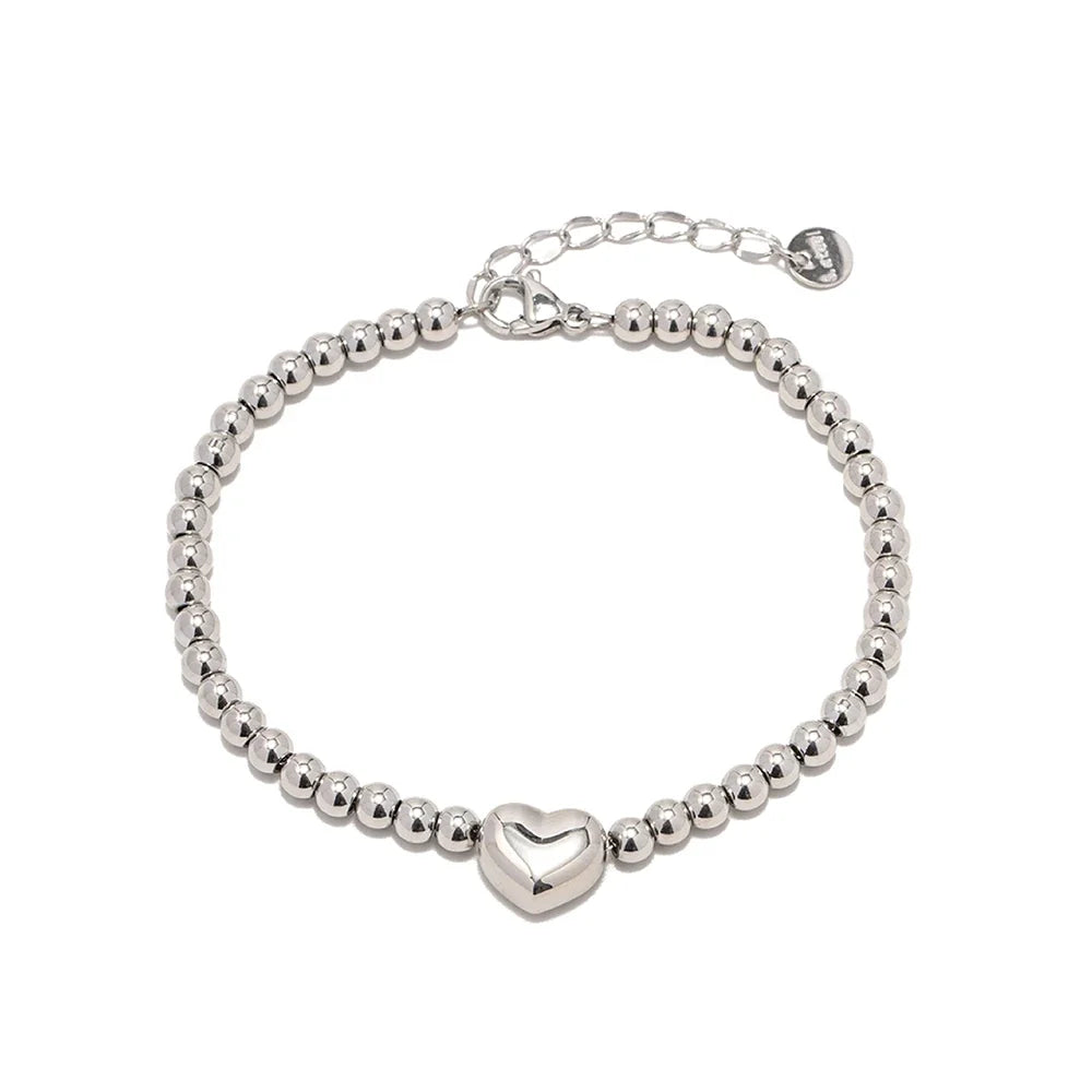 Elegancka bransoletka z koralikami i sercem, 18k