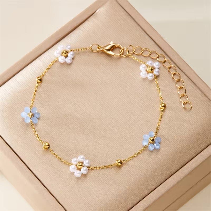 Collier et bracelets délicats à motif marguerite