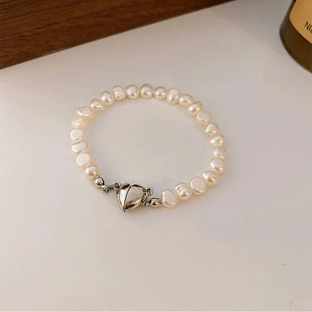 Naszyjnik typu choker i bransoletka z magnetycznym serduszkiem i perłą